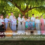 Ensemble der Theaterwerkstatt des Ukrainischen Kulturvereins mit Puppenbühne und Instrumenten auf dem Waiblinger Altstadtfest mit dem Text „Theaterwerkstatt: Anna von Kyjiw auf dem Waiblinger Altstadtfest“.